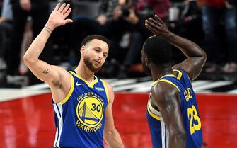 PORTLAND, OREGON - MAY 18: Stephen Curry #30 of the Golden State Warriors celebrates with Draymond Green #23 during the second half against the Portland Trail Blazers in game three of the NBA Western Conference Finals at Moda Center on May 18, 2019 in Portland, Oregon. NOTE TO USER: User expressly acknowledges and agrees that, by downloading and or using this photograph, User is consenting to the terms and conditions of the Getty Images License Agreement. (Photo by Steve Dykes/Getty Images)