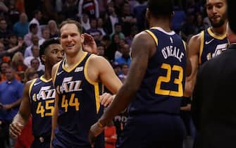 PHOENIX, ARIZONA - OCTOBER 28: Bojan Bogdanovic #44 of the Utah Jazz celebrates with Donovan Mitchell #45 and Royce O'Neale #23 following the NBA game against the Phoenix Suns at Talking Stick Resort Arena on October 28, 2019 in Phoenix, Arizona. The Jazz defeated the Suns 96-95. NOTE TO USER: User expressly acknowledges and agrees that, by downloading and/or using this photograph, user is consenting to the terms and conditions of the Getty Images License Agreement  (Photo by Christian Petersen/Getty Images)