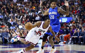 TORONTO, ON - OCTOBER 28:  Kyle Lowry #7 of the Toronto Raptors dribbles the ball as Markelle Fultz #20 of the Orlando Magic defends during the second half of an NBA game at Scotiabank Arena on October 28, 2019 in Toronto, Canada.  NOTE TO USER: User expressly acknowledges and agrees that, by downloading and or using this photograph, User is consenting to the terms and conditions of the Getty Images License Agreement.  (Photo by Vaughn Ridley/Getty Images)