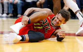 MIAMI, FLORIDA - OCTOBER 29:  Trae Young #11 of the Atlanta Hawks is reacts after being injured against the Miami Heat during the first half at American Airlines Arena on October 29, 2019 in Miami, Florida. NOTE TO USER: User expressly acknowledges and agrees that, by downloading and/or using this photograph, user is consenting to the terms and conditions of the Getty Images License Agreement. (Photo by Michael Reaves/Getty Images)