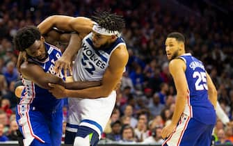 PHILADELPHIA, PA - OCTOBER 30: Joel Embiid #21 of the Philadelphia 76ers gets in a fight with Karl-Anthony Towns #32 of the Minnesota Timberwolves as Ben Simmons #25 looks on in the third quarter at the Wells Fargo Center on October 30, 2019 in Philadelphia, Pennsylvania. NOTE TO USER: User expressly acknowledges and agrees that, by downloading and or using this photograph, User is consenting to the terms and conditions of the Getty Images License Agreement. (Photo by Mitchell Leff/Getty Images)