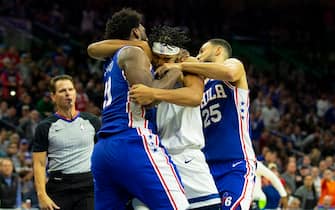 PHILADELPHIA, PA - OCTOBER 30: Joel Embiid #21 of the Philadelphia 76ers gets in a fight with Karl-Anthony Towns #32 of the Minnesota Timberwolves as Ben Simmons #25 tries to break them apart in the third quarter at the Wells Fargo Center on October 30, 2019 in Philadelphia, Pennsylvania. NOTE TO USER: User expressly acknowledges and agrees that, by downloading and or using this photograph, User is consenting to the terms and conditions of the Getty Images License Agreement. (Photo by Mitchell Leff/Getty Images)