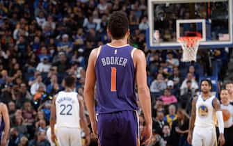 SAN FRANCISCO, CA - OCTOBER 30: Devin Booker #1 of the Phoenix Suns looks on during a game against the Golden State Warriors on October 30, 2019 at Chase Center in San Francisco, California. NOTE TO USER: User expressly acknowledges and agrees that, by downloading and or using this photograph, user is consenting to the terms and conditions of Getty Images License Agreement. Mandatory Copyright Notice: Copyright 2019 NBAE (Photo by Noah Graham/NBAE via Getty Images)