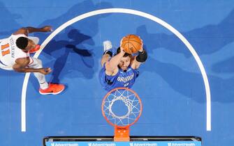 ORLANDO, FL - OCTOBER 30: Nikola Vucevic #9 of the Orlando Magic goes up for a dunk during the game against the New York Knicks on October 30, 2019 at Amway Center in Orlando, Florida. NOTE TO USER: User expressly acknowledges and agrees that, by downloading and or using this photograph, User is consenting to the terms and conditions of the Getty Images License Agreement. Mandatory Copyright Notice: Copyright 2019 NBAE (Photo by Fernando Medina/NBAE via Getty Images)