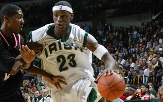 TRENTON, NJ - FEBRUARY 8:  LeBron James #23 of the St. Vincent-St. Mary Fighting Irish drives to the basket during the game against the LA Westchester Comets in the Primetime Shoot out at Sovereign Bank Arena on February 8, 2003 in Trenton, New Jersey.  The Irish won 78-52.  NOTE TO USER: User expressly acknowledges and agrees that, by downloading and/or using this Photograph, User is consenting to the terms and conditions of the Getty Images License Agreement Mandatory Copyright Notice:  Copyright 2003 NBAE  (Photo by Dave Saffran/NBAE via Getty Images) 