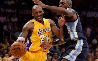 LOS ANGELES, CA - NOVEMBER 26:  Kobe Bryant #24 of the Los Angeles Lakers is fouled off the dribble by Quincy Pondexter #8 of the Memphis Grizzlies during the first half at Staples Center on November 26, 2014 in Los Angeles, California.  NOTE TO USER: User expressly acknowledges and agrees that, by downloading and or using this Photograph, user is consenting to the terms and condition of the Getty Images License Agreement.  (Photo by Harry How/Getty Images)