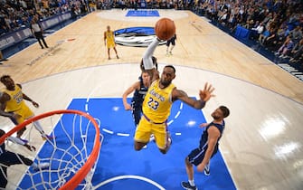 DALLAS, TX - NOVEMBER 1: LeBron James #23 of the Los Angeles Lakers dunks the ball against the Dallas Mavericks on November 1, 2019 at the American Airlines Center in Dallas, Texas. NOTE TO USER: User expressly acknowledges and agrees that, by downloading and/or using this Photograph, user is consenting to the terms and conditions of the Getty Images License Agreement. Mandatory Copyright Notice: Copyright 2019 NBAE (Photo by Jesse D. Garrabrant/NBAE via Getty Images)