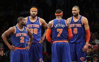 157473944 NEW YORK, NY - NOVEMBER 26: (NEW YORK DAILIES OUT) Raymond Felton #2, Rasheed Wallace #36, Carmelo Anthony #7 and Tyson Chandler #6 of the New York Knicks look on against the Brooklyn Nets at Barclays Center on November 26, 2012 in the Brooklyn borough of New York City.The Nets defeated the Knicks 96-89 in overtime. NOTE TO USER: User expressly acknowledges and agrees that, by downloading and/or using this Photograph, user is consenting to the terms and conditions of the Getty Images License Agreement. (Photo by Jim McIsaac/Getty Images)