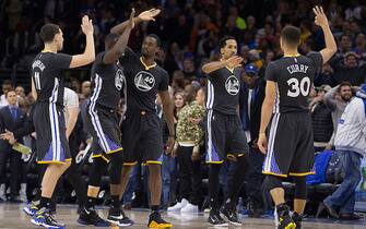 PHILADELPHIA, PA - JANUARY 30: Klay Thompson #11, Draymond Green #23, Harrison Barnes #40, Shaun Livingston #34 and Stephen Curry #30 high five one another in the game against the Philadelphia 76ers on January 30, 2016 at the Wells Fargo Center in Philadelphia, Pennsylvania. NOTE TO USER: User expressly acknowledges and agrees that, by downloading and or using this photograph, User is consenting to the terms and conditions of the Getty Images License Agreement. (Photo by Mitchell Leff/Getty Images) *** Local Caption *** Klay Thompson;Draymond Green;Harrison Barnes;Shaun Livingston;Stephen Curry