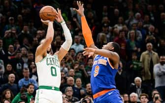 BOSTON, MA - NOVEMBER 1: Jayson Tatum #0 of the Boston Celtics shoots the game winning shot against R.J. Barrett #9 of the New York Knicks in the second half at TD Garden on November 1, 2019 in Boston, Massachusetts. NOTE TO USER: User expressly acknowledges and agrees that, by downloading and or using this photograph, User is consenting to the terms and conditions of the Getty Images License Agreement. (Photo by Kathryn Riley/Getty Images)