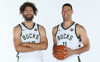 MILWAUKEE, WI - SEPTEMBER 30: Robin Lopez #42 and Brook Lopez #11 of the Milwaukee Bucks pose for a portrait during Media Day at Fiserv Forum on September 30, 2019 in Milwaukee, Wisconsin. NOTE TO USER: User expressly acknowledges and agrees that, by downloading and/or using this photograph, user is consenting to the terms and conditions of the Getty Images License Agreement.  Mandatory Copyright Notice: Copyright 2019 NBAE (Photo by Gary Dineen/NBAE via Getty Images)