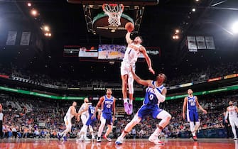 PHOENIX, AZ - NOVEMBER 4: Devin Booker #1 of the Phoenix Suns goes up for against a dunk against the Philadelphia 76ers on November 4, 2019 at Talking Stick Resort Arena in Phoenix, Arizona. NOTE TO USER: User expressly acknowledges and agrees that, by downloading and or using this photograph, user is consenting to the terms and conditions of the Getty Images License Agreement. Mandatory Copyright Notice: Copyright 2019 NBAE (Photo by Barry Gossage/NBAE via Getty Images)