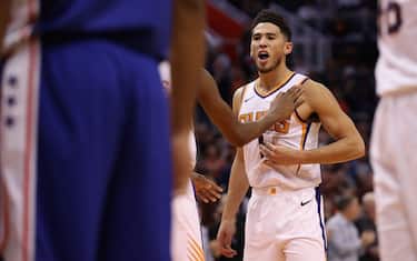 PHOENIX, ARIZONA - NOVEMBER 04: Devin Booker #1 of the Phoenix Suns reacts as he awaits a free-throw shot against the Philadelphia 76ers during the second half of the NBA game at Talking Stick Resort Arena on November 04, 2019 in Phoenix, Arizona.  The Suns defeated the 76ers 114-109.  NOTE TO USER: User expressly acknowledges and agrees that, by downloading and/or using this photograph, user is consenting to the terms and conditions of the Getty Images License Agreement (Photo by Christian Petersen/Getty Images)