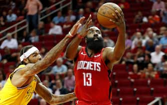 HOUSTON, TX - NOVEMBER 06:  James Harden #13 of the Houston Rockets goes up for a lay up defended by Willie Cauley-Stein #2 of the Golden State Warriors in the first half at Toyota Center on November 6, 2019 in Houston, Texas.    NOTE TO USER: User expressly acknowledges and agrees that, by downloading and or using this photograph, User is consenting to the terms and conditions of the Getty Images License Agreement.  (Photo by Tim Warner/Getty Images)