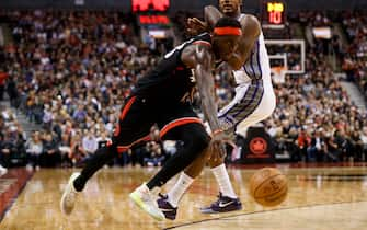 TORONTO, ON - NOVEMBER 06: Pascal Siakam #43 of the Toronto Raptors dribbles by Trevor Ariza #0 of the Sacramento Kings during second half of their NBA game at Scotiabank Arena on November 6, 2019 in Toronto, Canada. NOTE TO USER: User expressly acknowledges and agrees that, by downloading and or using this photograph, User is consenting to the terms and conditions of the Getty Images License Agreement. (Photo by Cole Burston/Getty Images)