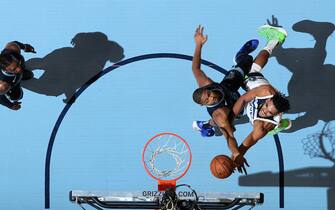 MEMPHIS, TN - NOVEMBER 6: Karl-Anthony Towns #32 of the Minnesota Timberwolves drives to the basket against the Memphis Grizzlies on November 6, 2019 at FedExForum in Memphis, Tennessee. NOTE TO USER: User expressly acknowledges and agrees that, by downloading and or using this photograph, User is consenting to the terms and conditions of the Getty Images License Agreement. Mandatory Copyright Notice: Copyright 2019 NBAE (Photo by Joe Murphy/NBAE via Getty Images)
