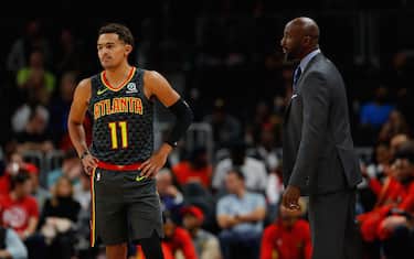 ATLANTA, GEORGIA - NOVEMBER 06:  Head coach Lloyd Pierce of the Atlanta Hawks converses with Trae Young #11 in the first half against the Chicago Bulls at State Farm Arena on November 06, 2019 in Atlanta, Georgia.  NOTE TO USER: User expressly acknowledges and agrees that, by downloading and/or using this photograph, user is consenting to the terms and conditions of the Getty Images License Agreement.  (Photo by Kevin C. Cox/Getty Images)