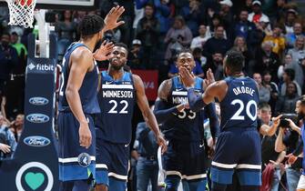 MINNEAPOLIS, MN - NOVEMBER 8: Andrew Wiggins #22 of the Minnesota Timberwolves high fives Karl-Anthony Towns #32 of the Minnesota Timberwolves after sending the game into overtime with a game-tying layup during a game against the Golden State Warriors on November 8, 2019 at Target Center in Minneapolis, Minnesota. NOTE TO USER: User expressly acknowledges and agrees that, by downloading and or using this Photograph, user is consenting to the terms and conditions of the Getty Images License Agreement. Mandatory Copyright Notice: Copyright 2019 NBAE (Photo by David Sherman/NBAE via Getty Images)