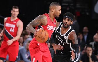 PORTLAND, OR - NOVEMBER 8: Damian Lillard #0 of the Portland Trail Blazers handles the ball Brooklyn Nets on November 8, 2019 at the Moda Center Arena in Portland, Oregon. NOTE TO USER: User expressly acknowledges and agrees that, by downloading and or using this photograph, user is consenting to the terms and conditions of the Getty Images License Agreement. Mandatory Copyright Notice: Copyright 2019 NBAE (Photo by Sam Forencich/NBAE via Getty Images)