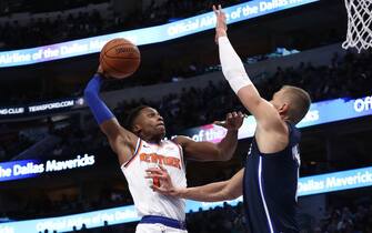 DALLAS, TEXAS - NOVEMBER 08:  Frank Ntilikina #11 of the New York Knicks takes a shot against Kristaps Porzingis #6 of the Dallas Mavericks in the first half at American Airlines Center on November 08, 2019 in Dallas, Texas.  NOTE TO USER: User expressly acknowledges and agrees that, by downloading and or using this photograph, User is consenting to the terms and conditions of the Getty Images License Agreement. (Photo by Ronald Martinez/Getty Images)