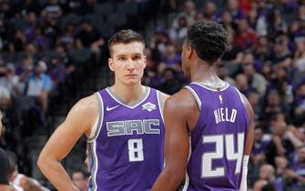 SACRAMENTO, CA - OCTOBER 25: Bogdan Bogdanovic #8 and Buddy Hield #24 of the Sacramento Kings face the Portland Trail Blazers on October 25, 2019 at Golden 1 Center in Sacramento, California. NOTE TO USER: User expressly acknowledges and agrees that, by downloading and or using this photograph, User is consenting to the terms and conditions of the Getty Images Agreement. Mandatory Copyright Notice: Copyright 2019 NBAE (Photo by Rocky Widner/NBAE via Getty Images)
