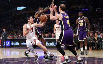 LOS ANGELES, CALIFORNIA - NOVEMBER 08:  Dwight Howard #39 and Alex Caruso #4 of the Los Angeles Lakers defend against Goran Dragic #7 of the Miami Heat during the first half of a game at Staples Center on November 08, 2019 in Los Angeles, California.  NOTE TO USER: User expressly acknowledges and agrees that, by downloading and/or using this photograph, user is consenting to the terms and conditions of the Getty Images License Agreement (Photo by Sean M. Haffey/Getty Images)