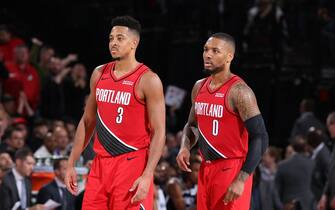 PORTLAND, OR - NOVEMBER 8: CJ McCollum #3 of the Portland Trail Blazers and Damian Lillard #0 of the Portland Trail Blazers look on against the Brooklyn Nets on November 8, 2019 at the Moda Center Arena in Portland, Oregon. NOTE TO USER: User expressly acknowledges and agrees that, by downloading and or using this photograph, user is consenting to the terms and conditions of the Getty Images License Agreement. Mandatory Copyright Notice: Copyright 2019 NBAE (Photo by Sam Forencich/NBAE via Getty Images)