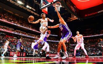 ATLANTA, GA - NOVEMBER 8: Trae Young #11 of the Atlanta Hawks passes the ball against the Sacramento Kings on November 8, 2019 at State Farm Arena in Atlanta, Georgia.  NOTE TO USER: User expressly acknowledges and agrees that, by downloading and/or using this Photograph, user is consenting to the terms and conditions of the Getty Images License Agreement. Mandatory Copyright Notice: Copyright 2019 NBAE (Photo by Scott Cunningham/NBAE via Getty Images)
