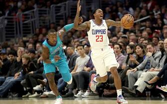 LOS ANGELES, CALIFORNIA - OCTOBER 28: Lou Williams #23 of the Los Angeles Clippers reacts to being fouled by Terry Rozier #3 of the Charlotte Hornets during the first half of a game at Staples Center on October 28, 2019 in Los Angeles, California. NOTE TO USER: User expressly acknowledges and agrees that, by downloading and or using this photograph, User is consenting to the terms and conditions of the Getty Images License Agreement. (Photo by Sean M. Haffey/Getty Images)