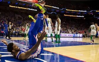 PHILADELPHIA, PA - MARCH 20: Joel Embiid #21 of the Philadelphia 76ers falls to the court against the Boston Celtics at the Wells Fargo Center on March 20, 2019 in Philadelphia, Pennsylvania. NOTE TO USER: User expressly acknowledges and agrees that, by downloading and or using this photograph, User is consenting to the terms and conditions of the Getty Images License Agreement.(Photo by Mitchell Leff/Getty Images)
