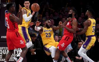LOS ANGELES, CALIFORNIA - FEBRUARY 21:  LeBron James #23 of the Los Angeles Lakers falls as he is fouled by James Harden #13 of the Houston Rockets, fouling out of the game, during a 111-106 Lakers win at Staples Center on February 21, 2019 in Los Angeles, California. (Photo by Harry How/Getty Images)