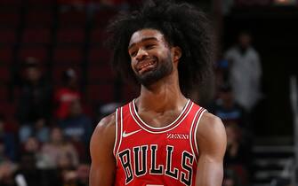 CHICAGO, IL - NOVEMBER 12: Coby White #0 of the Chicago Bulls smiles during the game against the New York Knicks on November 12, 2019 at the United Center in Chicago, Illinois. NOTE TO USER: User expressly acknowledges and agrees that, by downloading and or using this photograph, user is consenting to the terms and conditions of the Getty Images License Agreement.  Mandatory Copyright Notice: Copyright 2019 NBAE (Photo by Gary Dineen/NBAE via Getty Images)