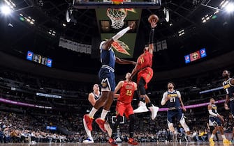 1182058067 DENVER, CO - NOVEMBER 12: Trae Young #11 of the Atlanta Hawks drives to the basket during a game against the Denver Nuggets on November 12, 2019 at the Pepsi Center in Denver, Colorado. NOTE TO USER: User expressly acknowledges and agrees that, by downloading and/or using this Photograph, user is consenting to the terms and conditions of the Getty Images License Agreement. Mandatory Copyright Notice: Copyright 2019 NBAE (Photo by Garrett Ellwood/NBAE via Getty Images)