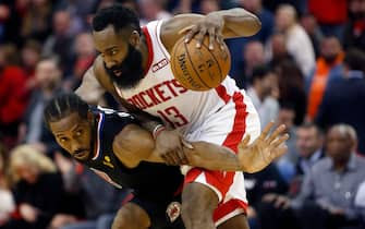 HOUSTON, TEXAS - NOVEMBER 13: James Harden #13 of the Houston Rockets is defended by Kawhi Leonard #2 of the Los Angeles Clippers during the fourth quarter at Toyota Center on November 13, 2019 in Houston, Texas. NOTE TO USER: User expressly acknowledges and agrees that, by downloading and/or using this photograph, user is consenting to the terms and conditions of the Getty Images License Agreement.  (Photo by Bob Levey/Getty Images)