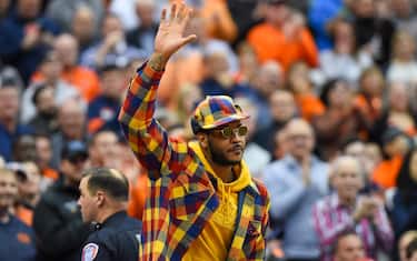 SYRACUSE, NY - NOVEMBER 06:  Syracuse Orange basketball alum Carmelo Anthony waves to the crowd during the first half of the game between the Virginia Cavaliers and the Syracuse Orange at the Carrier Dome on November 6, 2019 in Syracuse, New York. Virginia defeated Syracuse 48-34. (Photo by Rich Barnes/Getty Images)