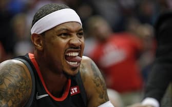 HOUSTON, TX - OCTOBER 24:  Carmelo Anthony #7 of the Houston Rockets reacts on the bench in the first half against the Utah Jazz at Toyota Center on October 24, 2018 in Houston, Texas.  NOTE TO USER: User expressly acknowledges and agrees that, by downloading and or using this Photograph, user is consenting to the terms and conditions of the Getty Images License Agreement.  (Photo by Tim Warner/Getty Images)