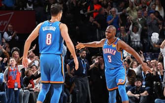 OKLAHOMA CITY, OK- NOVEMBER 15: Chris Paul #3 of the Oklahoma City Thunder and Danilo Gallinari #8 of the Oklahoma City Thunder celebrate after a play during a game against the Philadelphia 76ers on November 15, 2019 at Chesapeake Energy Arena in Oklahoma City, Oklahoma. NOTE TO USER: User expressly acknowledges and agrees that, by downloading and or using this photograph, User is consenting to the terms and conditions of the Getty Images License Agreement. Mandatory Copyright Notice: Copyright 2019 NBAE (Photo by Zach Beeker/NBAE via Getty Images)