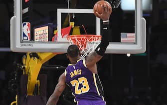 LOS ANGELES, CA - NOVEMBER 15: LeBron James #23 of the Los Angeles Lakers dunks over Nemanja Bjelica #88 of the Sacramento Kings during the first half at Staples Center on November 15, 2019 in Los Angeles, California. NOTE TO USER: User expressly acknowledges and agrees that, by downloading and/or using this Photograph, user is consenting to the terms and conditions of the Getty Images License Agreement. (Photo by Kevork Djansezian/Getty Images)
