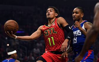 1182962584 LOS ANGELES, CA - NOVEMBER 16: Trae Young #11 of the Atlanta Hawks drives to the basket as he is fouled by Rodney McGruder #19 of the Los Angeles Clippers at Staples Center on November 16, 2019 in Los Angeles, California. NOTE TO USER: User expressly acknowledges and agrees that, by downloading and/or using this Photograph, user is consenting to the terms and conditions of the Getty Images License Agreement (Photo by Kevork Djansezian/Getty Images)