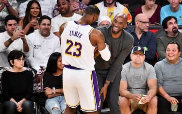 LOS ANGELES, CALIFORNIA - NOVEMBER 17: Kobe Bryant embraces LeBron James during a basketball game between the Los Angeles Lakers and the Atlanta Hawks at Staples Center on November 17, 2019 in Los Angeles, California. (Photo by Allen Berezovsky/Getty Images)