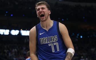 DALLAS, TEXAS - OCTOBER 27:  Luka Doncic #77 of the Dallas Mavericks reacts after being fouled by Hassan Whiteside #21 of the Portland Trail Blazers in the second half at American Airlines Center on October 27, 2019 in Dallas, Texas. NOTE TO USER: User expressly acknowledges and agrees that, by downloading and or using this photograph, User is consenting to the terms and conditions of the Getty Images License Agreement.  (Photo by Ronald Martinez/Getty Images)