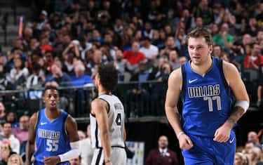 DALLAS, TX - NOVEMBER 18: Luka Doncic #77 of the Dallas Mavericks smiles during a game against the San Antonio Spurs on November 18, 2019 at the American Airlines Center in Dallas, Texas. NOTE TO USER: User expressly acknowledges and agrees that, by downloading and or using this photograph, User is consenting to the terms and conditions of the Getty Images License Agreement. Mandatory Copyright Notice: Copyright 2019 NBAE (Photo by Glenn James/NBAE via Getty Images)