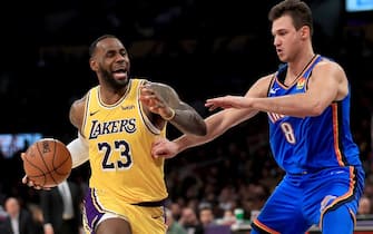 LOS ANGELES, CALIFORNIA - NOVEMBER 19:  LeBron James #23 of the Los Angeles Lakers dribbles past the defense of Danilo Gallinari #8 of the Oklahoma City Thunder during the second half of a game at Staples Center on November 19, 2019 in Los Angeles, California.  NOTE TO USER: User expressly acknowledges and agrees that, by downloading and/or using this photograph, user is consenting to the terms and conditions of the Getty Images License Agreement (Photo by Sean M. Haffey/Getty Images)