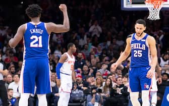 PHILADELPHIA, PA - NOVEMBER 20: Joel Embiid #21 and Ben Simmons #25 of the Philadelphia 76ers react against the New York Knicks in the fourth quarter at the Wells Fargo Center on November 20, 2019 in Philadelphia, Pennsylvania. The 76ers defeated the Knicks 109-104. NOTE TO USER: User expressly acknowledges and agrees that, by downloading and/or using this photograph, user is consenting to the terms and conditions of the Getty Images License Agreement. (Photo by Mitchell Leff/Getty Images)
