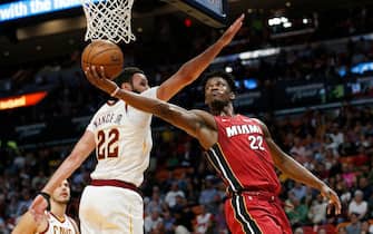 1189031137 MIAMI, FLORIDA - NOVEMBER 20: Jimmy Butler #22 of the Miami Heat attempts a layup against Larry Nance Jr. #22 of the Cleveland Cavaliers during the second half at American Airlines Arena on November 20, 2019 in Miami, Florida. NOTE TO USER: User expressly acknowledges and agrees that, by downloading and/or using this photograph, user is consenting to the terms and conditions of the Getty Images License Agreement. (Photo by Michael Reaves/Getty Images)
