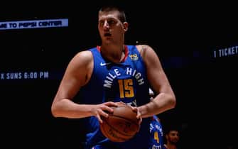 DENVER, CO - NOVEMBER 22: Nikola Jokic #15 of the Denver Nuggets looks on against the Boston Celtics on November 22, 2019 at the Pepsi Center in Denver, Colorado. NOTE TO USER: User expressly acknowledges and agrees that, by downloading and/or using this Photograph, user is consenting to the terms and conditions of the Getty Images License Agreement. Mandatory Copyright Notice: Copyright 2019 NBAE (Photo by Bart Young/NBAE via Getty Images)