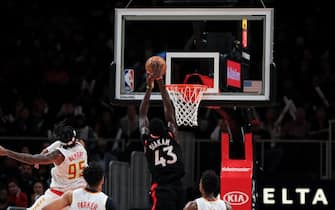ATLANTA, GA - NOVEMBER 23: Pascal Siakam #43 of the Toronto Raptors makes a basket during the fourth quarter in front of Atlanta Hawks defenders Jabari Parker #5, De'Andre Hunter #12, and DeAndre' Bembry #95 at State Farm Arena on November 23, 2019 in Atlanta, Georgia. NOTE TO USER: User expressly acknowledges and agrees that, by downloading and or using this photograph, User is consenting to the terms and conditions of the Getty Images License Agreement. (Photo by Carmen Mandato/Getty Images)