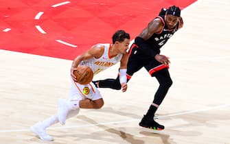 ATLANTA, GA - NOVEMBER 23: Trae Young #11 of the Atlanta Hawks handles the ball against the Toronto Raptors on November 23, 2019 at State Farm Arena in Atlanta, Georgia.  NOTE TO USER: User expressly acknowledges and agrees that, by downloading and/or using this Photograph, user is consenting to the terms and conditions of the Getty Images License Agreement. Mandatory Copyright Notice: Copyright 2019 NBAE (Photo by Scott Cunningham/NBAE via Getty Images)