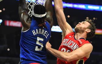 1184518256 LOS ANGELES, CA - NOVEMBER 24: Montrezl Harrell #5 of the Los Angeles Clippers dunks over Nicolo Melli #20 of the New Orleans Pelicans in the second half of the game against the New Orleans Pelicans at Staples Center on November 24, 2019 in Los Angeles, California. NOTE TO USER: User expressly acknowledges and agrees that, by downloading and/or using this Photograph, user is consenting to the terms and conditions of the Getty Images License Agreement. (Photo by Jayne Kamin-Oncea/Getty Images)
