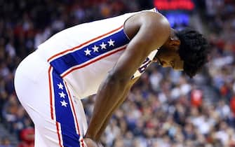 TORONTO, ON - NOVEMBER 25:  Joel Embiid #21 of the Philadelphia 76ers hangs his head during the second half of an NBA game against the Toronto Raptors at Scotiabank Arena on November 25, 2019 in Toronto, Canada.  NOTE TO USER: User expressly acknowledges and agrees that, by downloading and or using this photograph, User is consenting to the terms and conditions of the Getty Images License Agreement.  (Photo by Vaughn Ridley/Getty Images)